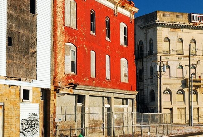 Urban decay with abandoned buildings in a rundown neighborhood.