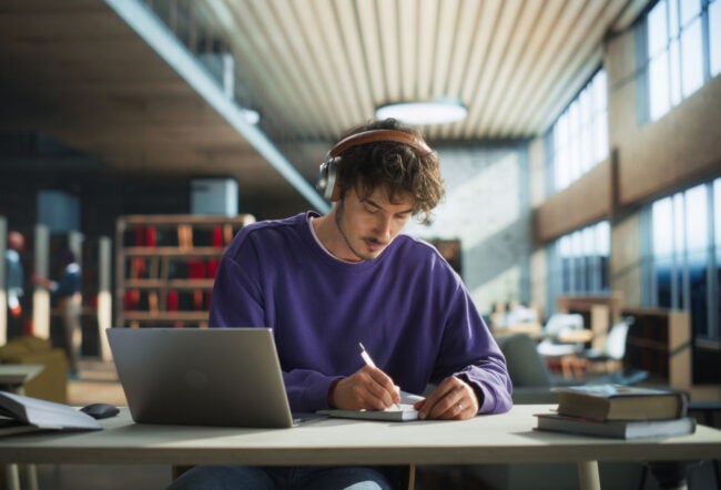 College student studying in a library